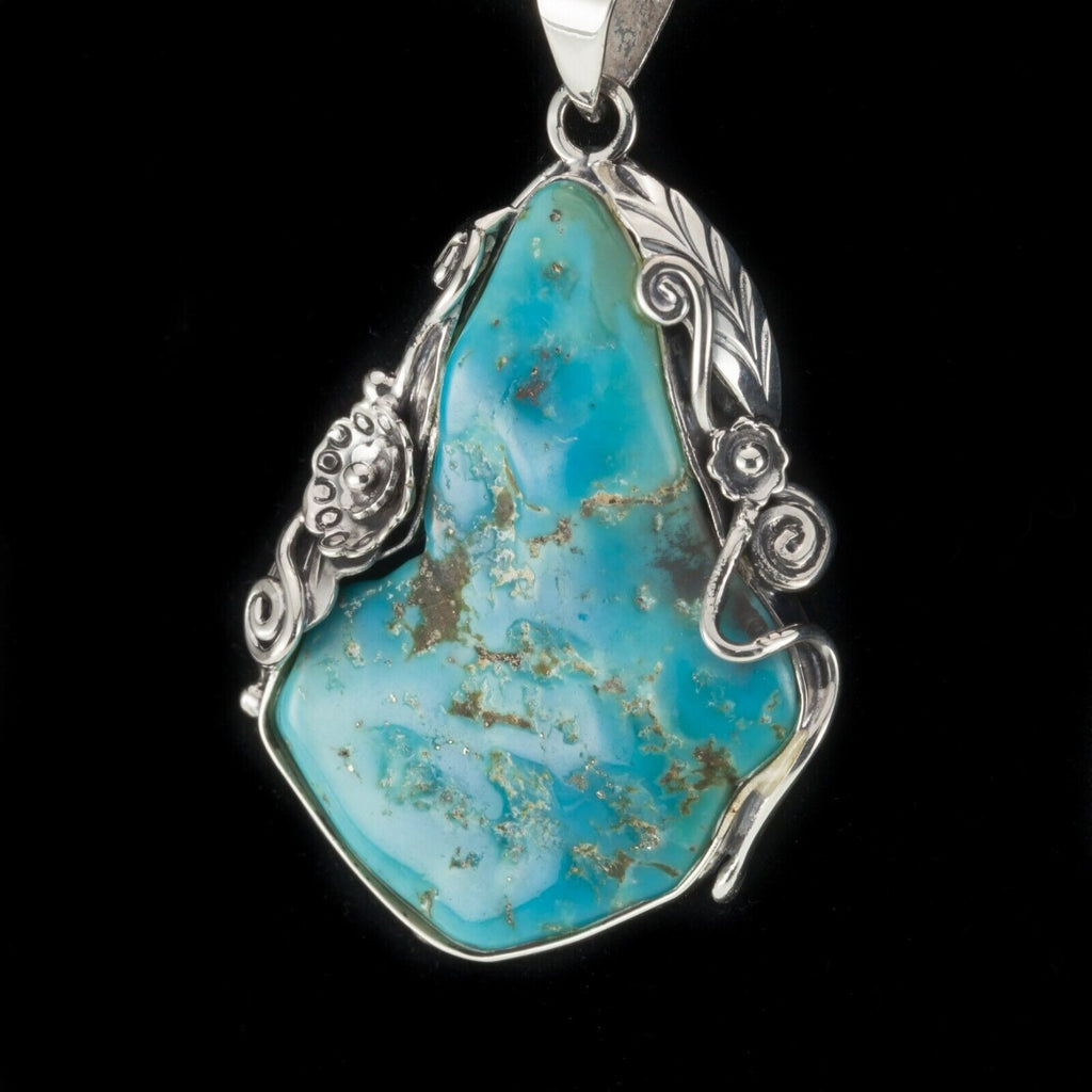 Amazing Turquoise Sterling Silver Pendant Set on a Floral Frame