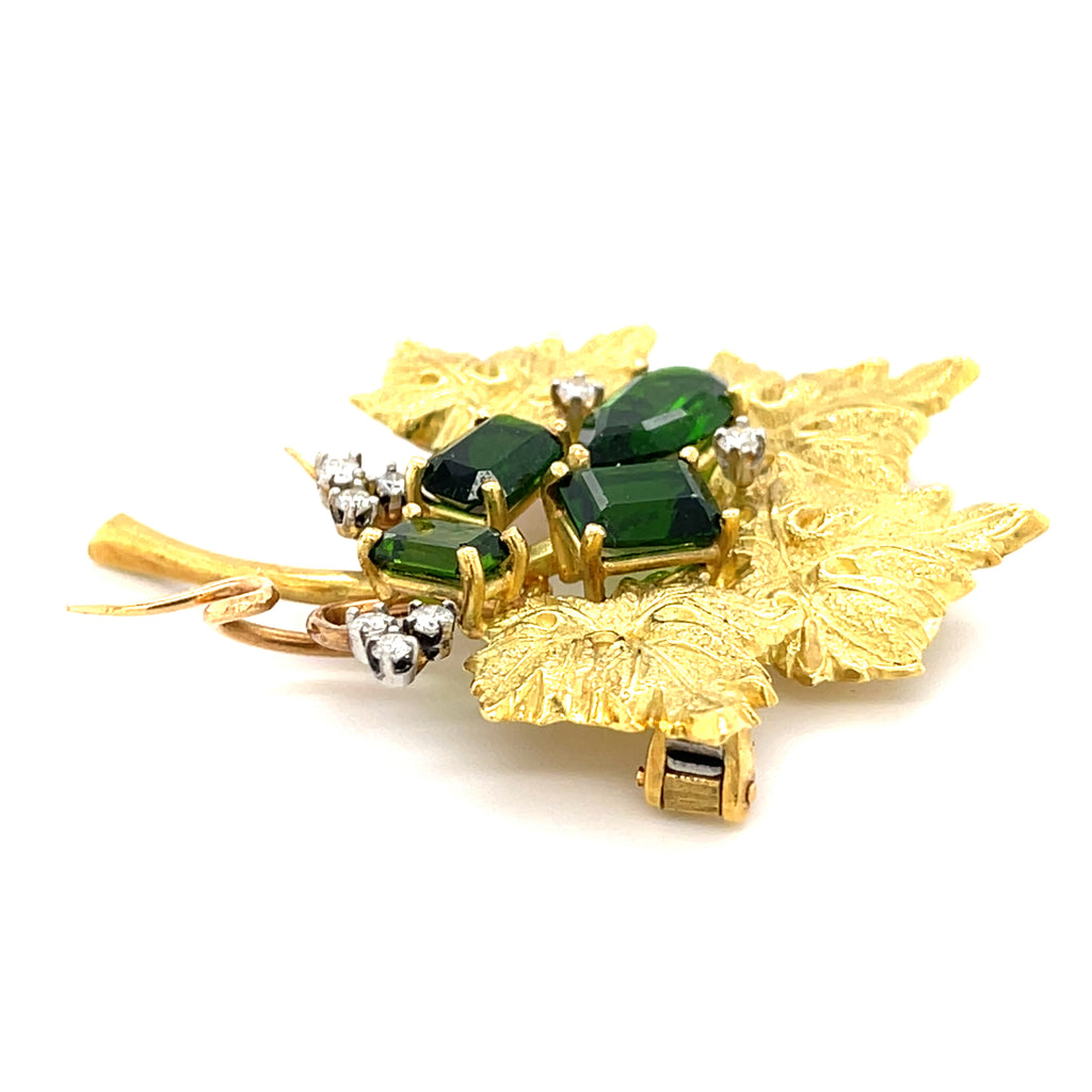 18k Yellow Gold & Green Tourmaline Leaf Brooch w/ 0.24ct Diamond Accents.
