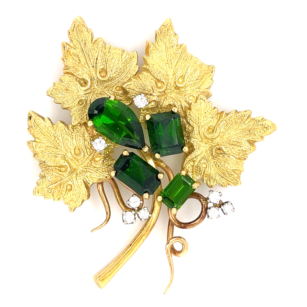 18k Yellow Gold & Green Tourmaline Leaf Brooch w/ 0.24ct Diamond Accents.