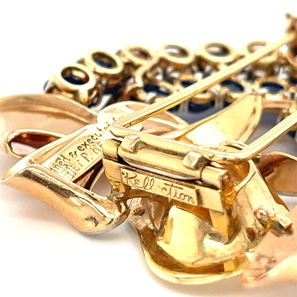 Trabert & Hoeffer Mauboussin Platinum-Topped 14k Gold Brooch w/ Sapphire and Diamonds.
