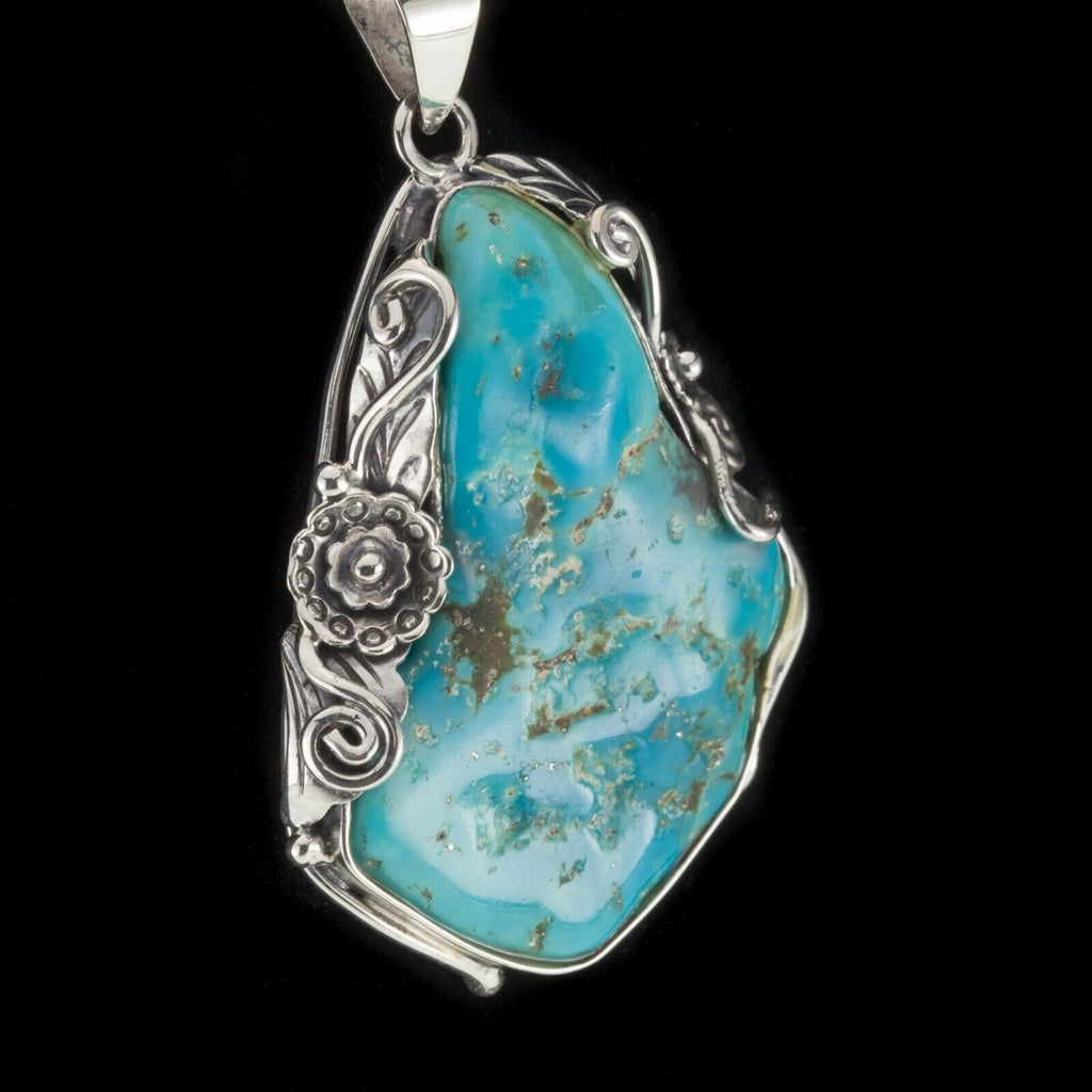 Amazing Turquoise Sterling Silver Pendant Set on a Floral Frame