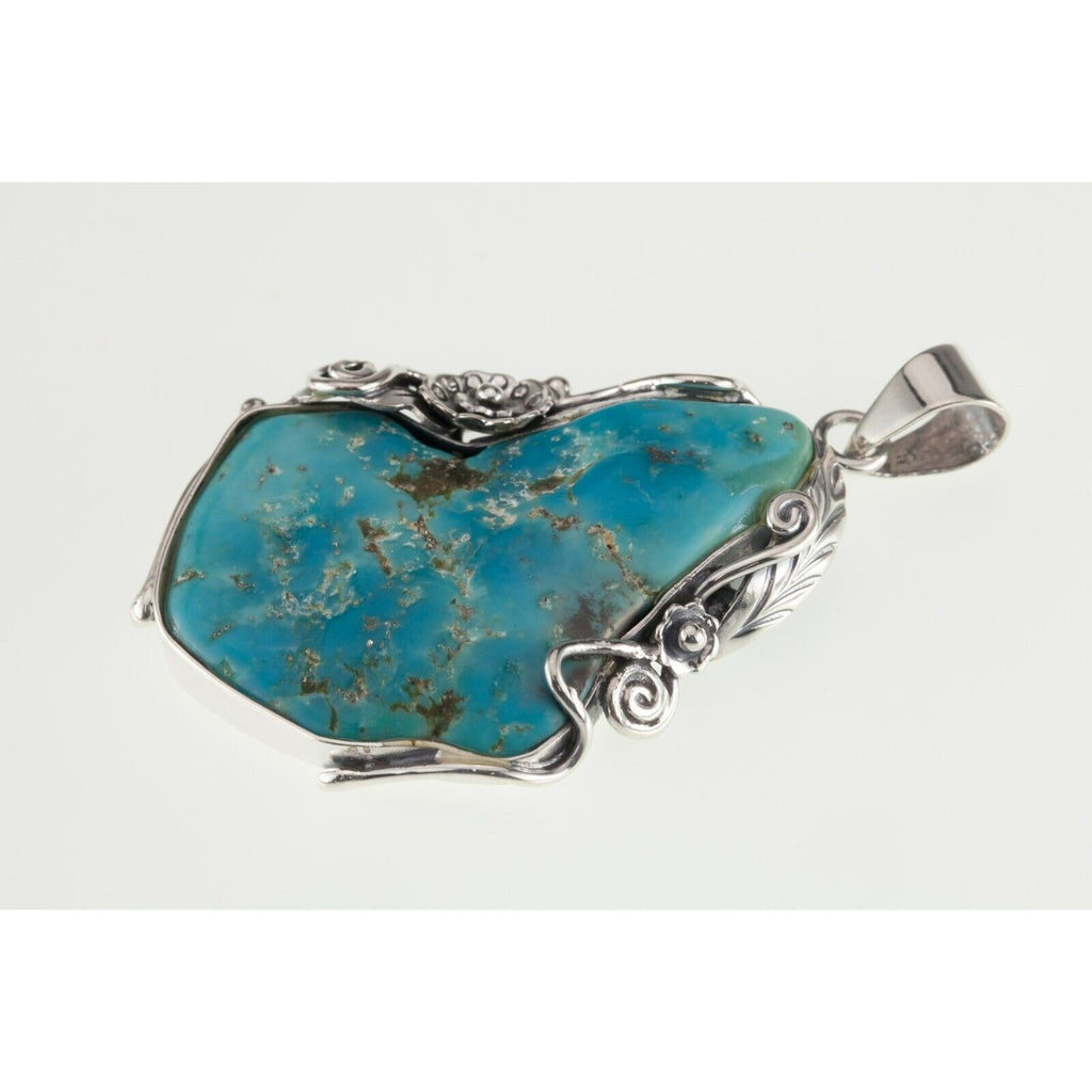 Amazing Turquoise Sterling Silver Pendant Set on a Floral Frame