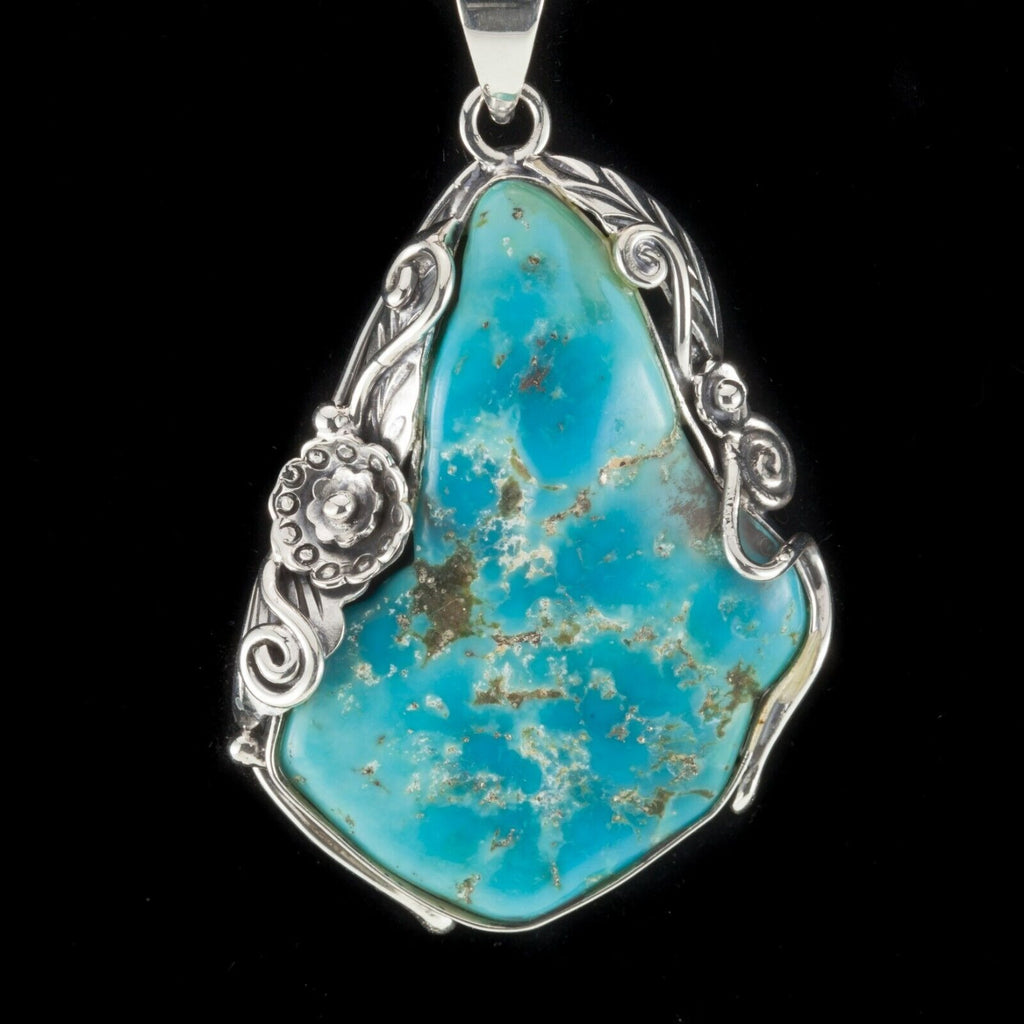 Amazing Turquoise Sterling Silver Pendant Set on a Floral Frame