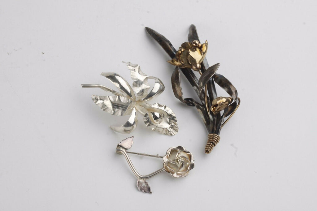 THREE (3) VINTAGE STERLING SILVER FLOWER BROOCHES
